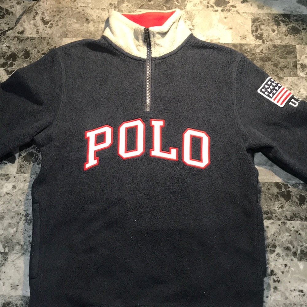 Long sleeve Polo sweater.